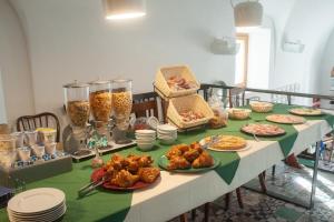 a table topped with plates of food on top at Sopra il Limoneto in Cetara