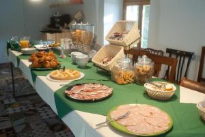 a long table with plates of food on it at Sopra il Limoneto in Cetara