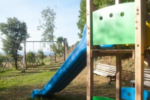 a slide in a park with a playground at Sopra il Limoneto in Cetara