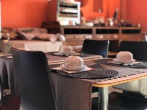 Um restaurante ou outro lugar para comer em Alojamento Local S. Bartolomeu