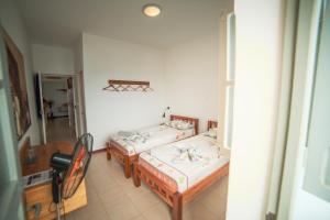 Postel nebo postele na pokoji v ubytování Música do Mar