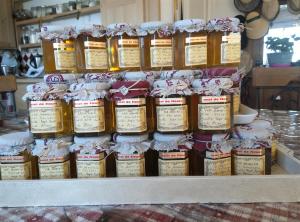 a bunch of jars of food sitting on a shelf at L'enchanteur in Saint-Jurs +27 photos
