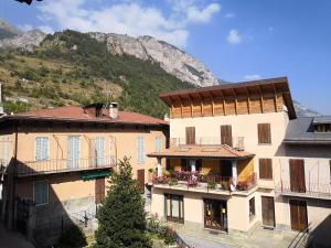 a group of buildings with a mountain in the background at Appartamento la Torre Vinadio in Vinadio