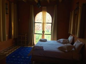 Postel nebo postele na pokoji v ubytování Kasbah Titrit & Spa