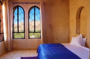 Postel nebo postele na pokoji v ubytování Kasbah Titrit & Spa