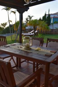 a wooden table with a glass bowl on top of it at Casa Garcia-Mar in Los Quemados