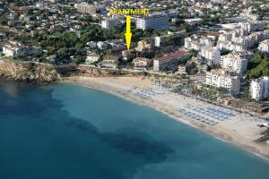 an aerial view of a beach with a yellow tower at Levante Apartment by Albir Proper Properties in Albir