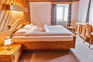 Posteľ alebo postele v izbe v ubytovaní Hotel Bernina Hospiz