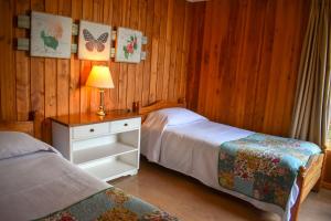 Voodi või voodid majutusasutuse Cabañas Monte Verde toas