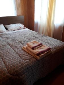 Ένα ή περισσότερα κρεβάτια σε δωμάτιο στο Cabañas Nortesur