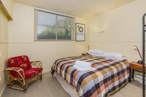 En eller flere senge i et værelse på Bayswater Holiday Home