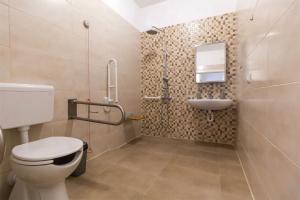 a bathroom with a toilet and a sink at Apartments Hana in Pula +36 photos