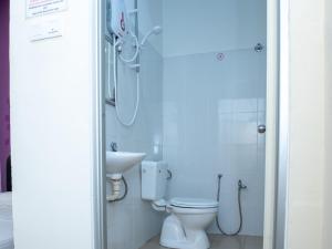 a bathroom with a toilet and a sink at Hotel Bestari in Malacca