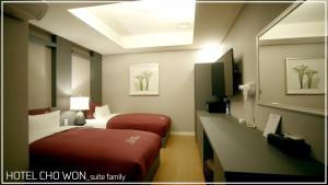 Postel nebo postele na pokoji v ubytování Hotel Chowon