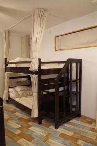 Postel nebo postele na pokoji v ubytování Cinnamon Guesthouse Dogo