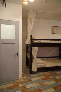 Postel nebo postele na pokoji v ubytování Cinnamon Guesthouse Dogo