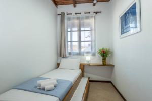 Posteľ alebo postele v izbe v ubytovaní Diktamo House