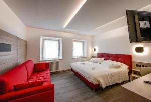 Posteľ alebo postele v izbe v ubytovaní Hotel Ambra