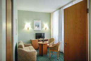TV a/nebo společenská místnost v ubytování Hotel "Helle Mitte" Berlin