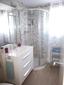 a bathroom with a shower and a white sink at Santa Barbara 18 in Alicante