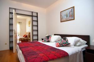 Postel nebo postele na pokoji v ubytování Nikic Apartments