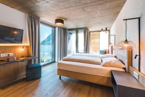 Posteľ alebo postele v izbe v ubytovaní Seehotel Einwaller - adults only