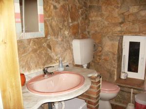 a bathroom with a sink and a toilet at Monte Viana in Fuzeta +37 photos
