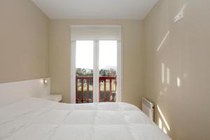 Ένα ή περισσότερα κρεβάτια σε δωμάτιο στο Luxury apartment with sea view in Hendaye (France) +18 φωτογραφίες