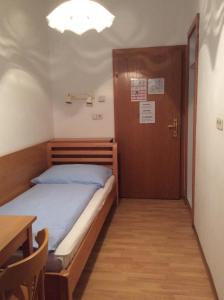 Postel nebo postele na pokoji v ubytování Hotel Pribitzer