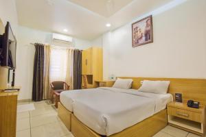 Llit o llits en una habitació de SAAS Residency