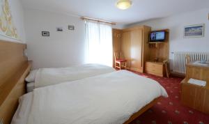 Postel nebo postele na pokoji v ubytování Hotel Presena