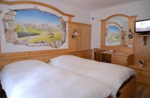 Кровать или кровати в номере Hotel Presena