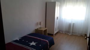 Posteľ alebo postele v izbe v ubytovaní Apartamento TISARE wifi