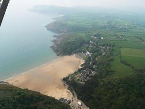an aerial view of a beach next to the ocean at Ortari@70 in Bishopston
