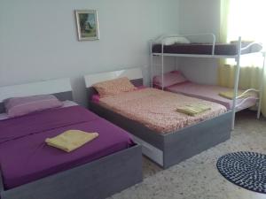 Postel nebo postele na pokoji v ubytování NOEMI & JULIENNE