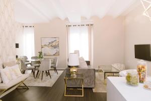 a living room with a couch and a table at Julio Antonio Apartment Center in Valencia