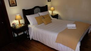 Кровать или кровати в номере Casa do Sr. Falcão