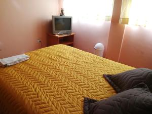 Cama o camas de una habitación en Chapelet Hostal