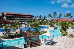 an aerial view of a resort with a swimming pool at Apto Oka Beach Residence in Porto De Galinhas