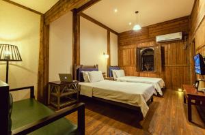 Voodi või voodid majutusasutuse Pig's Boutique Hotel Bishan toas