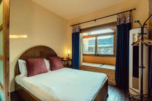 Voodi või voodid majutusasutuse Pig's Boutique Hotel Bishan toas