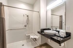 a white bathroom with a sink and a shower at Motel 6-Mankato, MN in Mankato
