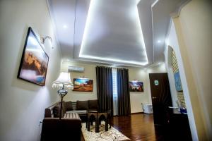 a living room with a couch and a table at Arkanchi Boutique Hotel in Khiva +22 photos