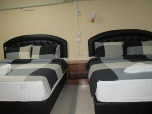 Postel nebo postele na pokoji v ubytování Pineapple Guesthouse