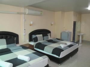 Postel nebo postele na pokoji v ubytování Pineapple Guesthouse