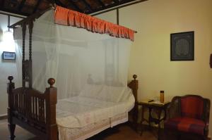 Mangaal Farmstay Goa tesisinde bir odada yatak veya yataklar