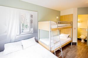 a bedroom with a bed and a desk at B&B HOTEL Nantes Rezé St Sébastien in Saint-Sébastien-sur-Loire