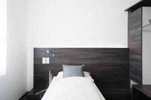 Rúm í herbergi á eee Hotel Traun