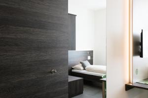Rúm í herbergi á eee Hotel Traun