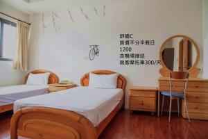 Postel nebo postele na pokoji v ubytování Mingyuan Homestay